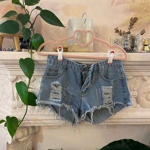Distressed denim jean booty shorts | medium light wash